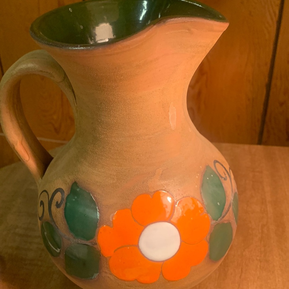 Beautiful ceramic pottery pitcher with floral design